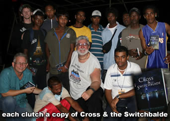 street gang memeber cltuch copies of the Cross adn the Switchbalde